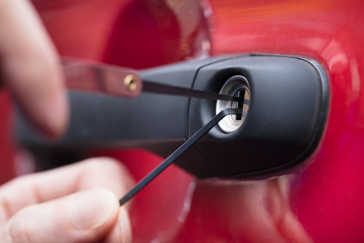 close up of car locksmith unlocking vehicle